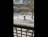 Woman thick fur jacket boots snow tripod