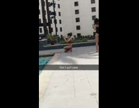 Girl poses on pool steps for photo