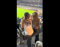 Woman uses friends leg as chair