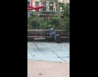man has karaoke machine at a playground
