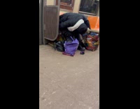 Man bends down falls asleep on subway