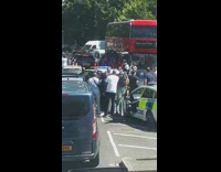 Two police cars red double decker bus 