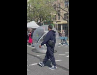 Woman in white dress inside the bubble ball