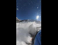 Skier lands into snow on parachute