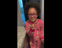 Girl bites spicy chili pepper 