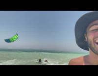 Guy falls off surf kite on shore 