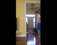 Guy hides behind wall scares brother, gets slapped on back and falls on the floor