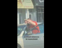 Collab winy - Man in Orange Yells While on the Phone Next to Car 