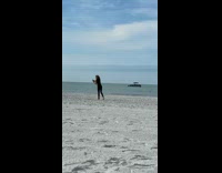 Woman black outfit selfie video dance beach