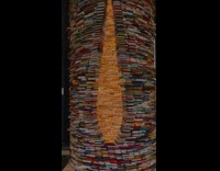 Person Looks Inside Pillar Stack of Books