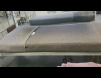 Bed bunks inside military barracks gray bed