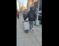 Man walk dirty laundry on skateboard street