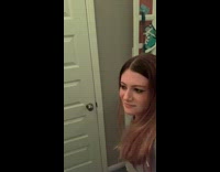 Guy playing christmas music behind womans bedroom door