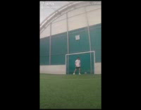 Red shirt guy kicks soccer ball phone 