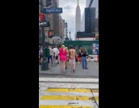 Man wears mankini shirt design on street