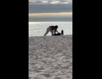 Woman bikini top poses for beach photo Part 2