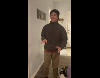 Man sing and touches cat to meow