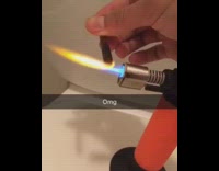 Guy lights his blunt with a  blow torch and accidentally sets his hair on fire