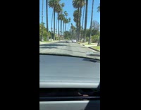 Woman sit down pose middle of the road photo shoot