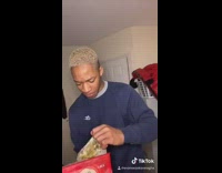 Guy opens red ice cream container food