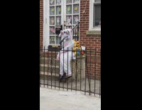 Creepy easter bunny prop in front of house