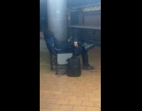 Man bring own chair at train station