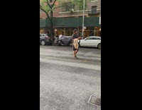 Couple pink dress piggy back ride street