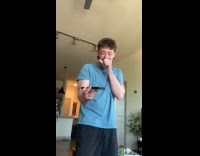 Man laughs at hold music