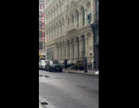 Man wears black jacket stretches on sidewalk part 1