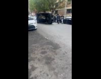 Woman still inside black car flipped sideways