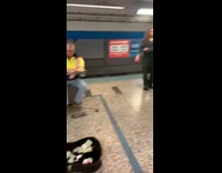 man plays guitar station dog jumping police