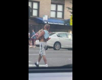Collab WINY - Shirtless man carry pet tortoise on street