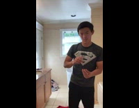 Guy catch all stacked pennies on elbow