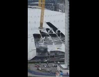 Tarp from building in construction flies off