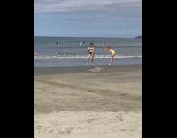 Woman black swimsuit burger print dance beach