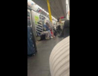 Men doing stunt performance on subway train