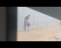 Guy wearing costume mask with electric guitar 