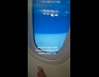 Submitter complaining about plane window with no shade 