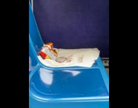 Bag of chips and pack left on  bus chair
