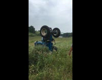 Blue tractor falls and drives itself