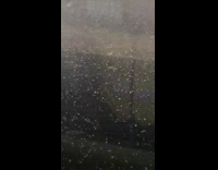 Man films strong thunderstorm and hail at office