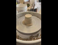 Brown clay spinning on clay wheel 