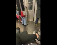 Person does footwork on train 