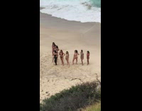 Women group bikini v formation beach pictorial