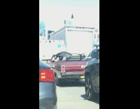 Collab winy - Guy in red convertible car black umbrella 