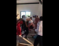 Man swings woman around at wedding