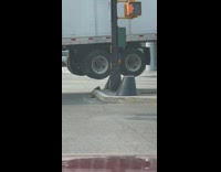 Truck with wheels over pole 
