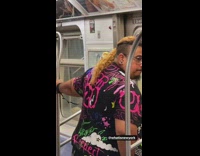 Guy exits train with yellow bird 