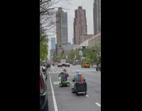 Two Guys on Beach Chair Electric Skateboards go Down Street 