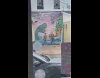 Couple grey shirt green monster mural car